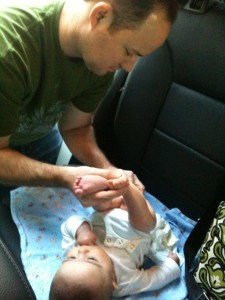 Daddy changing Lil B in the car.